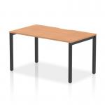 This photograph features a sleek and modern Dynamic Bench Desk Starter Unit from the Evolve Plus series. The desk is 1400mm long and has a single starter setup, with a stylish oak top and a sleek black frame. Perfect for any stylish and functional office space.