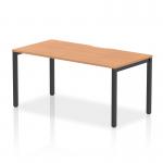 This picture shows a modern office desk featuring a 1600mm oak top with a sleek black frame. The design is a dynamic bench desk starter unit from the Evolve Plus collection, perfect for a single workstation in a contemporary workspace.