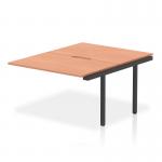 A photograph of the Dynamic Bench Desk Add On Units Evolve Plus 1200mm B2B Office Bench Desk Ext Kit with a beech top and black frame would show a sleek and modern workspace solution. The desk add on units provide versatility and the beech top adds a touch of warmth, while the black frame adds a touch of sophistication.