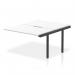 This photo showcases a sleek and modern office setup with a dynamic bench desk. The add on units add functionality and the white top with black frame gives a professional look. Perfect for a B2B office space.