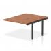The photograph shows a sleek and modern Dynamic Bench Desk with Add On Units, measuring 1200mm. The desk is made of walnut top and has a black frame. This office bench desk is part of the Evolve Plus collection, perfect for any B2B setting.