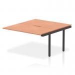 The picture shows two sleek, modern bench desk add-on units with a beech top and black frame. The 1400mm size is perfect for an office setting, providing ample space for work or meetings. The dynamic design creates a professional and functional workspace.