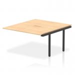 The bench desk add on units in the Evolve Plus 1400mm B2B Office Bench Desk Ext Kit feature a stylish and modern design, with a sleek maple top and a sturdy black frame. These dynamic units are perfect for a professional and efficient workspace.