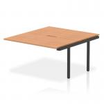 The photo of the Dynamic Bench Desk Add On Units Evolve Plus 1400mm B2B Office Bench Desk Ext Kit Oak Top Black Frame BE928 shows a modern and sleek desk setup. The desk has a sturdy black frame and a beautiful oak top, creating a professional and stylish look. The add-on units add more storage and functionality to the desk. Perfect for any office space.