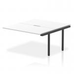 This photograph features a sleek and modern dynamic bench desk add on unit from the Evolve Plus series, with a length of 1400mm. The desk is equipped with a white top and a black frame, adding a touch of contrast to any office space. Perfect for a professional and functional work environment.