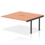 This image depicts a sleek, modern 1600mm bench desk add on unit from the Evolve Plus series. The beech wood top and black frame give it a professional, sophisticated look that would elevate any office space. Perfect for creating a dynamic and functional work area.