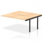 The photo shows a sleek and modern Dynamic Bench Desk Add On Unit from Evolve Plus. Its 1600mm Maple Top and Black Frame create a professional and stylish look for any B2B office environment. This Ext Kit provides additional space and functionality to any bench desk.