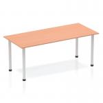 This image features a sleek and modern Dynamic Tables Impulse 1800mm straight table. The table has a stylish beech top and is supported by sturdy silver post legs. Its clean and minimalistic design is perfect for any office space.