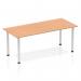 This image shows a sleek and modern Dynamic Tables Impulse 1800mm straight table with an oak top and silver post leg. The table exudes a clean and professional aesthetic, perfect for any office or workspace.