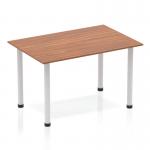 The Dynamic Tables Impulse 1200mm Straight Table features a sleek walnut top and modern silver post legs. Its streamlined design adds a touch of elegance to any space, making it a versatile choice for both home and office environments.