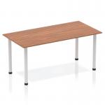 The picture shows a sleek and modern 1600mm straight table with a walnut top and silver post legs. Its dynamic design creates a professional and stylish look for any workspace.