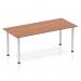 This image shows a sleek and modern Dynamic Tables Impulse 1800mm Straight Table with a rich walnut top and silver post legs. The table is ready to provide a functional and stylish workspace for any office or meeting room.
