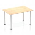 This photo shows a sleek, modern Dynamic Tables Impulse 1200mm Straight Table with a maple wood top and silver post legs. The streamlined design and clean lines make it a stylish addition to any space.