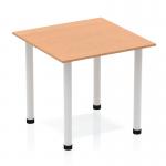 In this photograph, we see a stunning Dynamic Tables Impulse 800mm square table with an oak top and silver post legs. The table exudes elegance and sophistication, with its sleek design and neutral color scheme. The perfect addition to any modern office or workspace.