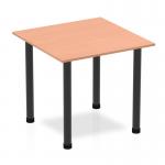 The photo of the Dynamic Tables Impulse 800mm Square Table features a smooth beech top with sleek black post legs. The modern and dynamic design creates a clean and professional look for any office or workspace.