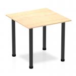 This photo features a sleek and modern Dynamic Tables Impulse 800mm Square Table with a maple top and black post leg. The clean, angular lines and contrasting colors create a striking visual effect. The table appears sturdy and versatile, suitable for a variety of settings.