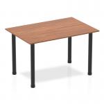 A sleek, modern table with a 1200mm straight walnut top and black post legs. The dynamic design adds a touch of style to any space.