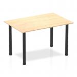 This photograph shows a 1200mm straight table with a maple top and black post leg. The table features dynamic tables that can be easily rearranged and adjusted to create various configurations. The minimalist design adds a sleek touch to any space.
