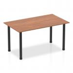 This photograph showcases a sleek 1400mm straight table with a walnut top and black post leg. The tables appear to have a dynamic, modern design that will add a touch of sophistication to any space. The dark wood finish of the top contrasts beautifully with the bold black legs, creating a visually striking piece of furniture.