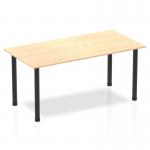 The image shows a dynamic tables impulse 1600mm straight table with a maple top and black post leg. The table is sleek and modern, perfect for a contemporary office space. The maple top adds warmth while the black post leg adds a touch of sophistication. This table is functional and stylish.