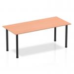 This photo captures a sleek and modern Dynamic Tables Impulse 1800mm Straight Table, featuring a beech wood top and black post legs. The table exudes a professional and contemporary vibe, making it a versatile choice for any workspace.