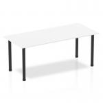 This photograph features a sleek and modern Dynamic Tables Impulse 1800mm straight table. The white top contrasts beautifully against the bold black post legs, creating a stylish and dynamic workspace.