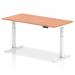 This photo showcases a modern office setup with a dynamic sit stand and height adjustable desk in the center. The desk has a white leg and a beech top, measuring 1600 x 800mm. The desk is raised, allowing for a more ergonomic and comfortable working position.