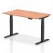 The photo shows a sleek and modern Dynamic Sit Stand and Height Adjustable Desk with a Beech top and Black legs. The desk measures 1400 x 800mm and offers adjustable height options, making it suitable for any office space.