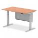 This image shows a sleek and modern dynamic sit stand and height adjustable desk featuring a beech top and silver legs. The desk also has a silver steel modesty panel, adding both style and functionality to any office space.