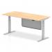 The photograph captures a sleek and modern office desk that is both dynamic and versatile. It has a maple top and silver leg with a matching steel modesty panel. The desk is 1800 x 800mm and can be easily adjusted in height to accommodate different needs. Perfect for any office space.