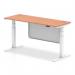 The photo shows a sleek, modern office desk with a beech top and white steel legs. It features cable ports for convenient organization and a white steel modesty panel for added privacy. The desk is height adjustable and can easily switch between standing and sitting. Its dimensions are 1600mm x 600mm, making it a versatile and practical addition to any workspace.