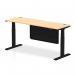This photograph features a dynamic sit-stand and height adjustable desk, measuring 1800 x 600mm. The desk has a modern maple top with convenient cable ports and black legs, accented by a sleek black steel modesty panel. Perfect for a stylish and functional office space.