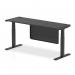 This photograph showcases a sleek and modern office space with two dynamic sit stand and height adjustable desks. The desks feature a black top, cable ports, and black legs, as well as a black steel modesty panel. The desks are 1800 x 600mm in size and offer versatility for any workspace.