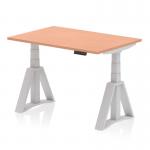 This photograph shows a dynamic sit-stand desk with an adjustable height of 1200 x 800mm. The beech top and silver legs give it a modern look, while the piste foot adds stability and functionality. Perfect for any office space.