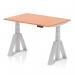 This photograph shows a dynamic sit-stand desk with an adjustable height of 1200 x 800mm. The beech top and silver legs give it a modern look, while the piste foot adds stability and functionality. Perfect for any office space.
