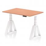 This photograph shows a sleek and modern office space with a Dynamic Sit Stand and Height Adjustable Desk. The desk features a 1200 x 800mm beech top and a white leg with a Piste Foot for stability. The height adjustability allows for a comfortable and ergonomic work experience.