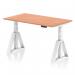 The picture shows a modern and practical office desk, measuring 1400 x 800mm, with a beech top and white legs. The desk is equipped with a dynamic sit stand feature and can also be adjusted to different heights. The unique piste foot adds a touch of style to the overall design.