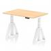 The photograph shows a sleek and modern office desk, with a dynamic sit-stand feature. The desk is 1200 x 800mm and has a maple top and white legs. The unique feature is the Piste foot, allowing for easy height adjustments. Ideal for any office space looking for versatility and functionality.