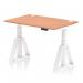 This photograph features a stylish and practical office desk, with a beech top and white leg. The desk is 1200 x 800mm in size and is height adjustable, allowing for a dynamic sit-stand option. It also includes cable ports and a piste foot, providing a sleek and organized workspace.