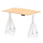The photograph shows a sleek and modern office desk measuring 1200 x 800mm. It features a maple top with built-in cable ports and a white leg with a piste foot for stability. This dynamic sit stand and height adjustable desk allows for versatile positioning options.