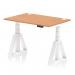 In the photo, we can see a sleek and modern office desk with a smooth oak top and white adjustable legs. The desk also features cable ports for easy organization and a piste foot for added stability. This dynamic sit stand and height adjustable desk offers versatility and functionality for any workspace.