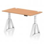 This picture shows a sleek and modern office desk with a natural oak top and white legs. The desk is 1400 x 800mm and features a dynamic sit stand option for adjustable height. It also includes convenient cable ports and a unique piste foot design.