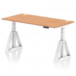 The image shows a modern office desk with a sleek oak top and white legs. The desk is equipped with cable ports for easy organization and a piste foot for stability. It is also height adjustable, allowing for versatile use.