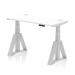 This photograph features a Dynamic Sit Stand and Height Adjustable Desks Air in the dimensions of 1200 x 600mm. The desk has a sleek white top with cable ports and is supported by a silver leg with a piste foot.