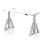 This picture showcases a versatile workplace solution - a dynamic sit stand and height adjustable desk. The desk has a sleek white top with integrated cable ports, supported by silver legs with a piste foot for stability. It measures 1400 x 600mm and is perfect for any modern office environment.