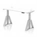 This picture showcases a versatile workplace solution - a dynamic sit stand and height adjustable desk. The desk has a sleek white top with integrated cable ports, supported by silver legs with a piste foot for stability. It measures 1400 x 600mm and is perfect for any modern office environment.