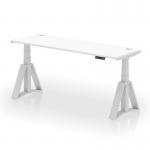 This photo features a sleek and modern Dynamic Sit Stand and Height Adjustable Desk with a white top and silver legs. The desk measures 1800 x 600mm and includes cable ports and a Piste Foot for added convenience.