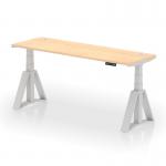 The photo shows a spacious workspace with a dynamic sit stand and height adjustable desk. The desk features a 1800 x 600mm maple top, cable ports, and silver legs with a piste foot. The adjustable design allows for a comfortable and ergonomic work experience.