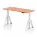 The picture shows a dynamic sit stand and height adjustable desk, measuring 1400 x 600mm. The desk features a beech top with cable ports, white legs, and a piste foot. It can be adjusted to various heights to accommodate different working preferences and needs.