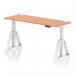 There is a spacious and modern Dynamic Sit Stand and Height Adjustable Desk with a beech top and white legs. It features cable ports and a Piste foot for stability. The desk measures 1600 x 600mm and can be adjusted for comfortable sitting or standing.